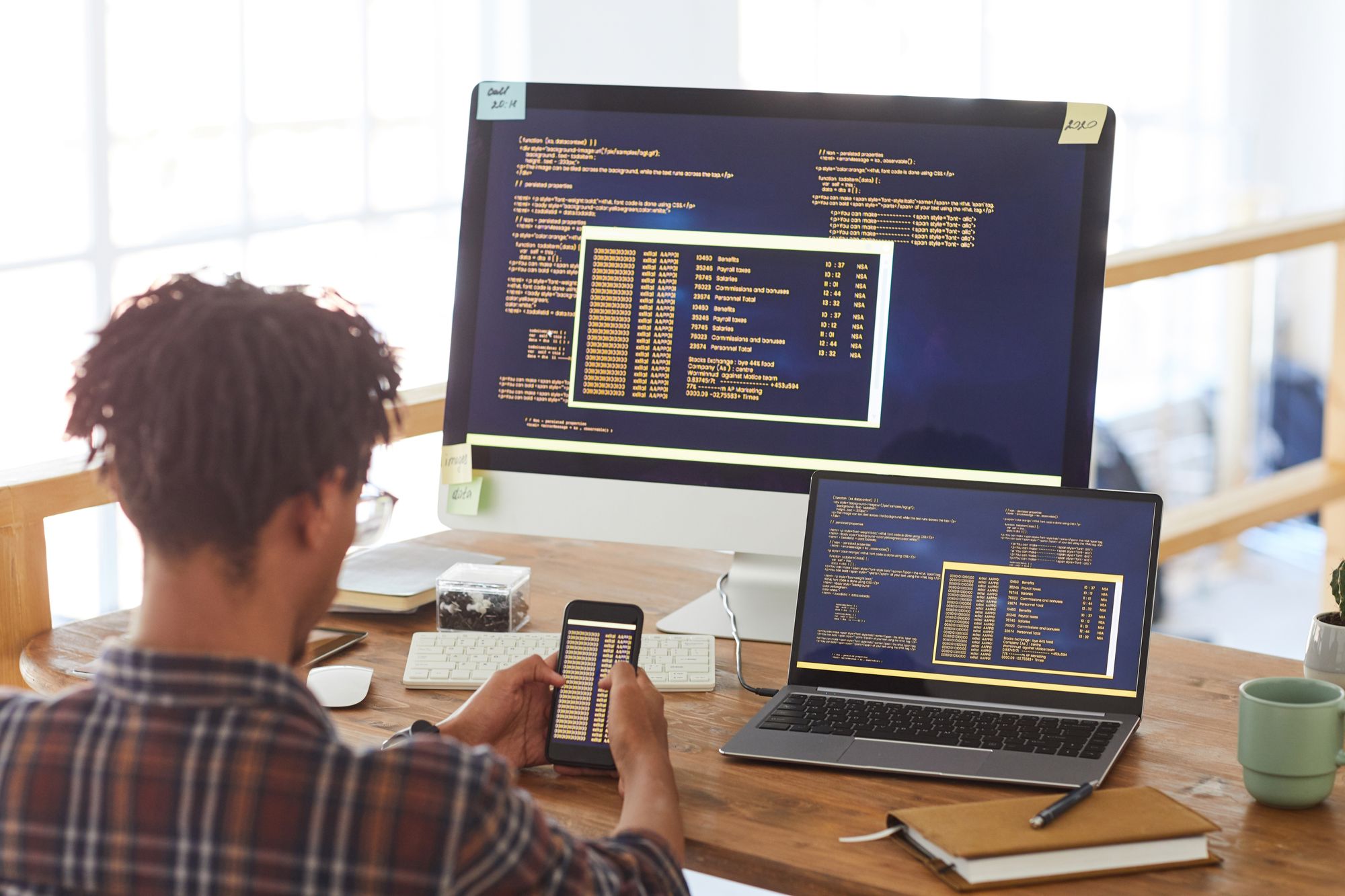 african-american-it-developer-writing-code-K4KHRMS
